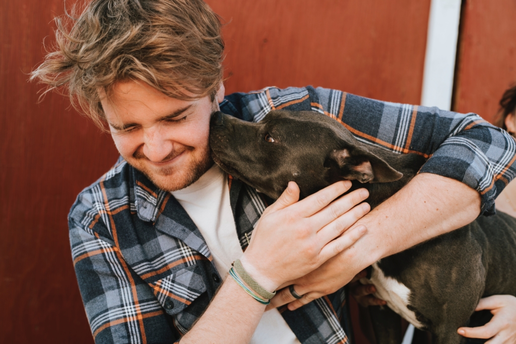 An adopted pit bull cheering up his handler