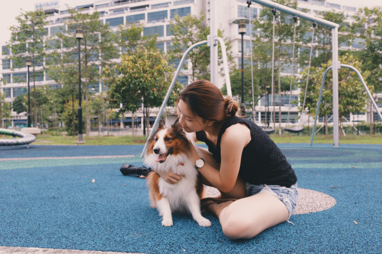 Woman on college campus with Emotional Support Dog